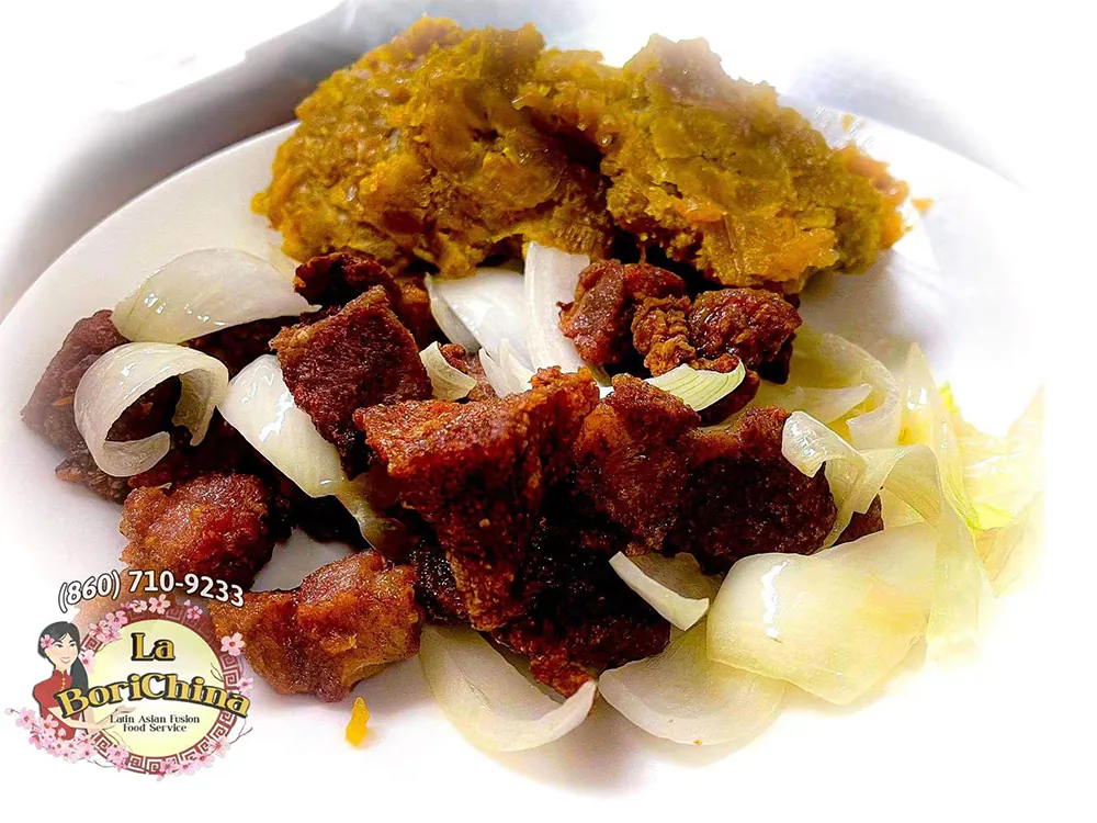 Fried Meat with Onions and Yuca at La Borichina, Asian Restaurant in Hartford
